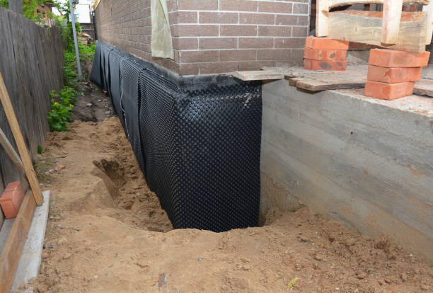 Happy homeowners after waterproofing job in Woodstown
